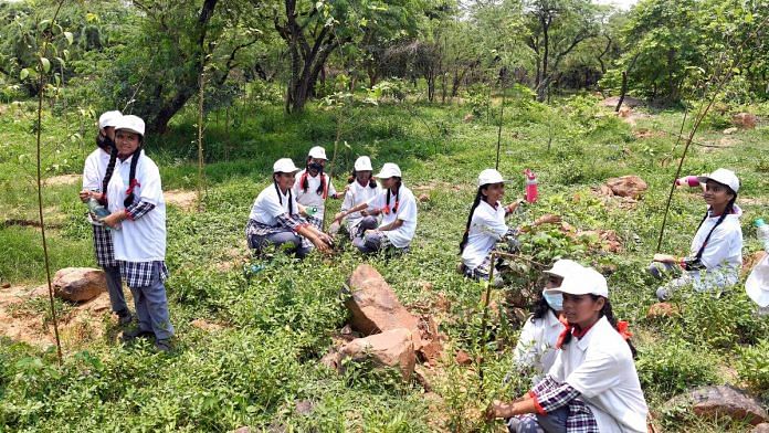 Representational image of students planting saplings during a plantation drive | Photo: ANI