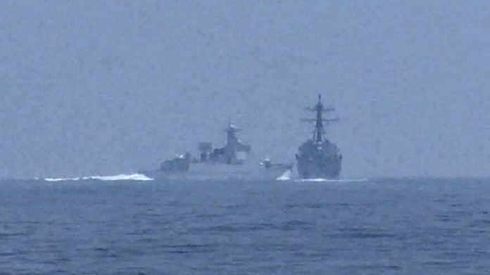 China's warship crosses the path of US Navy destroyer USS Chung-Hoon as it was transiting the Taiwan Strait with the Royal Canadian Navy frigate HMCS Montreal, on 3 June 2023, in a still image from video | Global News via Reuters