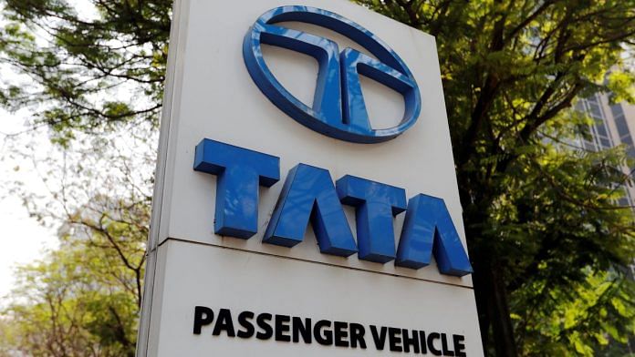 A Tata Motors logo is pictured outside the company showroom in Mumbai | Reuters