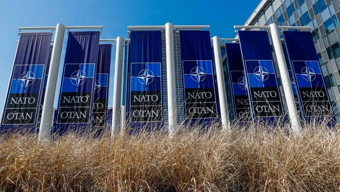 Banners displaying the NATO logo are placed at the entrance of new NATO headquarters during the move to the new building, in Brussels, Belgium | Reuters