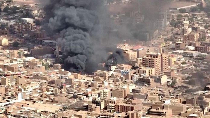 An aerial view of the black smoke and flames at a market in Omdurman, Khartoum North, Sudan | Reuters