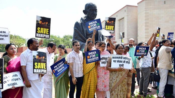Opposition parties (I.N.D.I.A) alliance MPs protest in front of Gandhi statue, demanding PM Modi's statement on Manipur ethnic violence in both houses, during the ongoing Monsoon Session, in New Delhi on Monday | Reuters