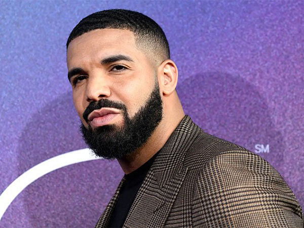 Drake leaves hotel in bulldog mask ahead of 'For All the Dogs' release