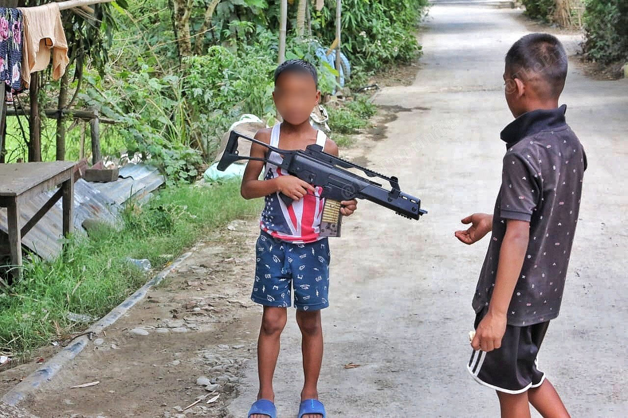 A boy plays with a toy gun at a village in Imphal East district | Praveen Jain | ThePrint