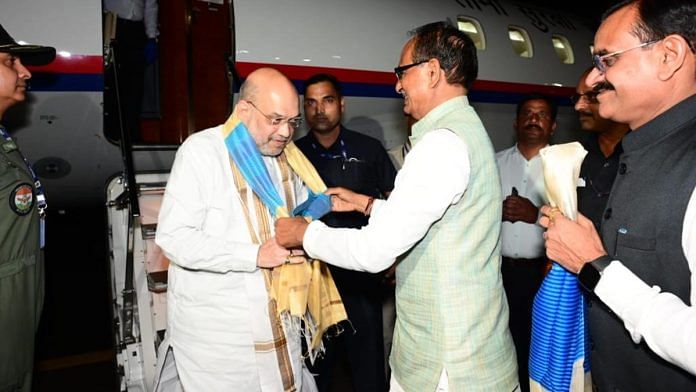 MP CM Shivraj Singh Chouhan and state BJP chief VD Sharma with Union Home Minister Amit Shah in Bhopal, Wednesday | Twitter @BJP4MP