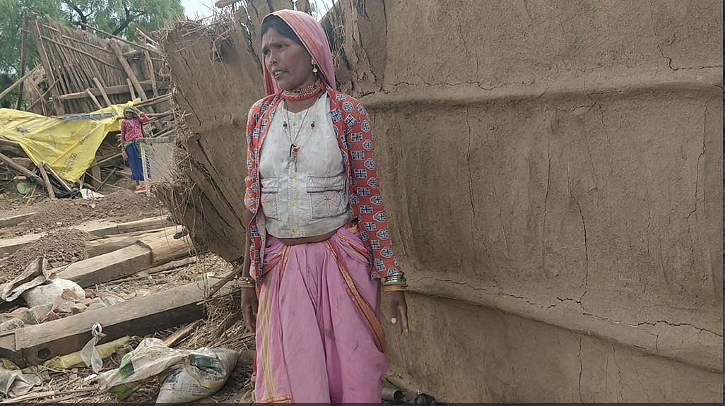 Tribal woman stands near a demolished house in Burhanpur | Shubhangi Misra, ThePrint