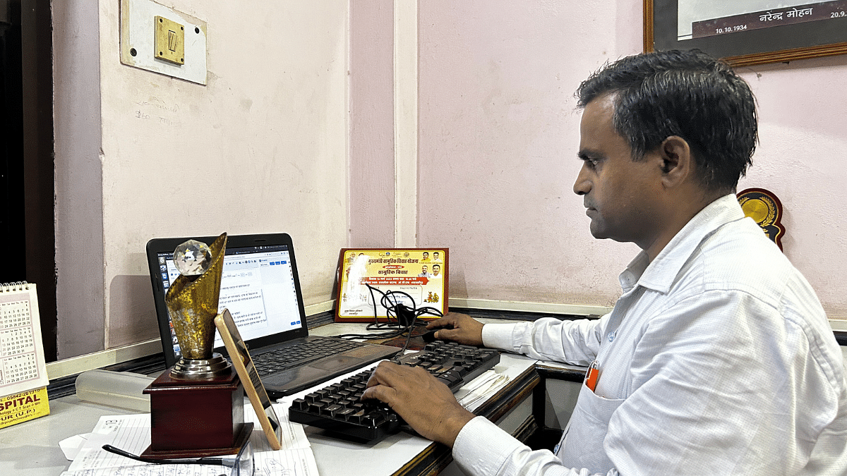 Investigating journalist Narender Yadav filing stories in Dainik Jagran's office. He is guarded 24x7 by a gunman from UP police after the Supreme Court directed the state government to provide him security | Jyoti Yadav/ThePrint
