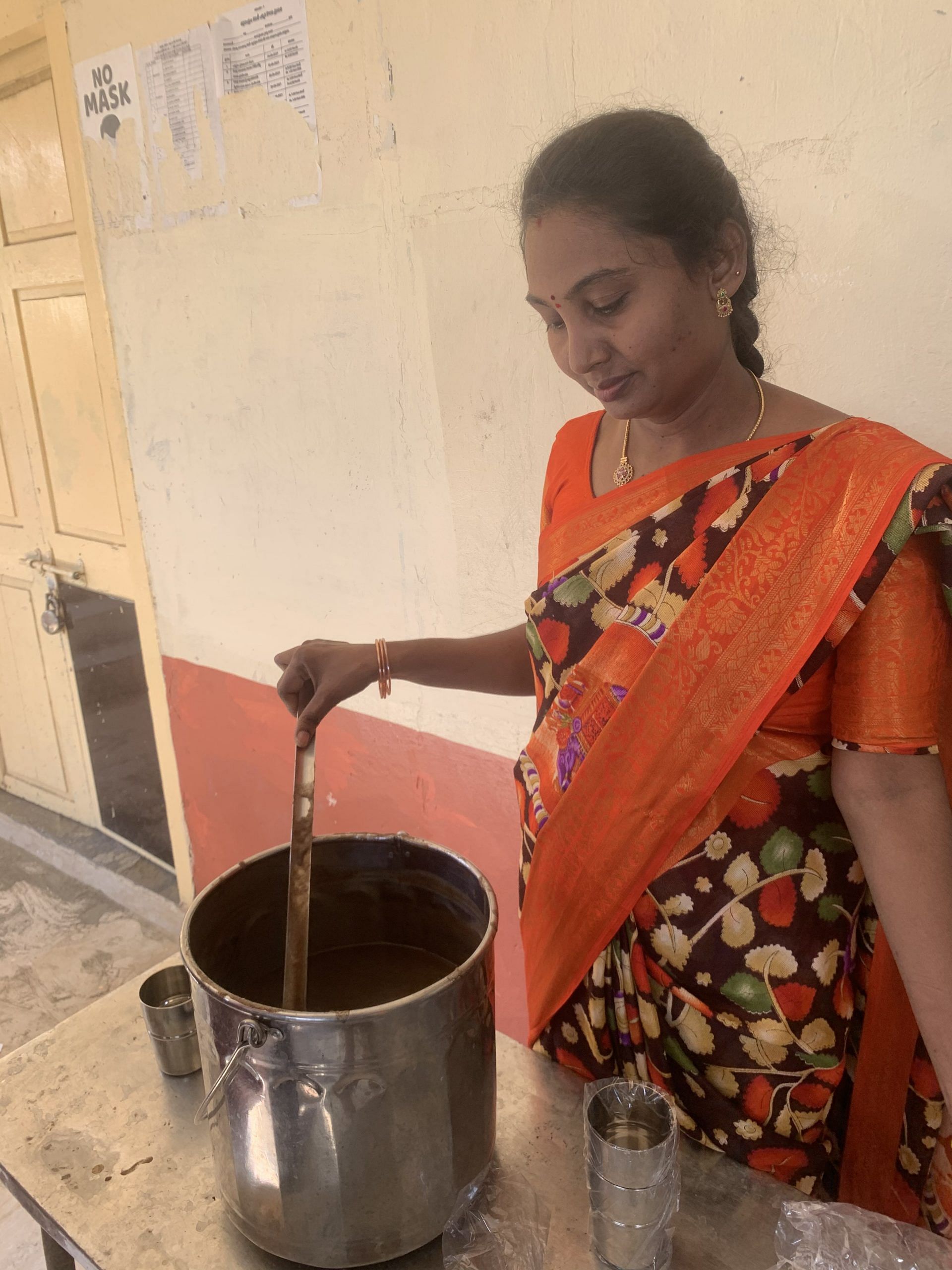  Yadala Sujatha, BRIG High School’s PTA head, serving students a malt-based drink | Antara Baruah, ThePrint