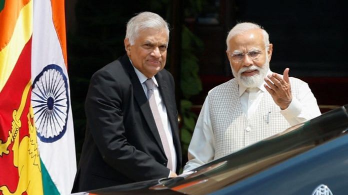 PM Narendra Modi and Sri Lanka's President Ranil Wickremesinghe stand together, on the day of their meeting at the Hyderabad House in New Delhi | Reuters