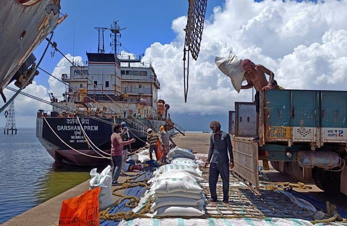 Labourers unload rice bags from a supply truck at India's main rice port at Kakinada Anchorage in the southern state of Andhra Pradesh | Reuters file photo