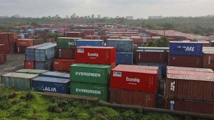 Cargo containers are seen stacked outside the container terminal of Jawaharlal Nehru Port Trust (JNPT) in Mumbai | File Photo: Reuters