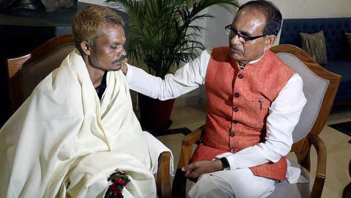 Madhya Pradesh CM Shivraj Singh Chouhan meets Dashmat Rawat, the victim of the Sidhi urination incident, at the CM's residence, in Bhopal last week | ANI