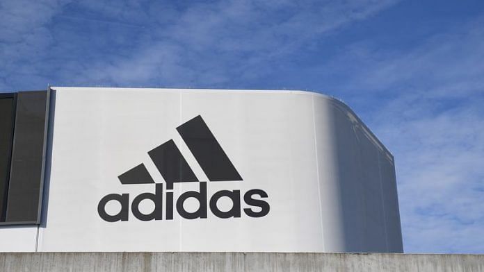 The Adidas logo is pictured during celebrations for German sports apparel maker Adidas' 70th anniversary at the company's headquarters in Herzogenaurach, Germany, August 9, 2019 | Reuters