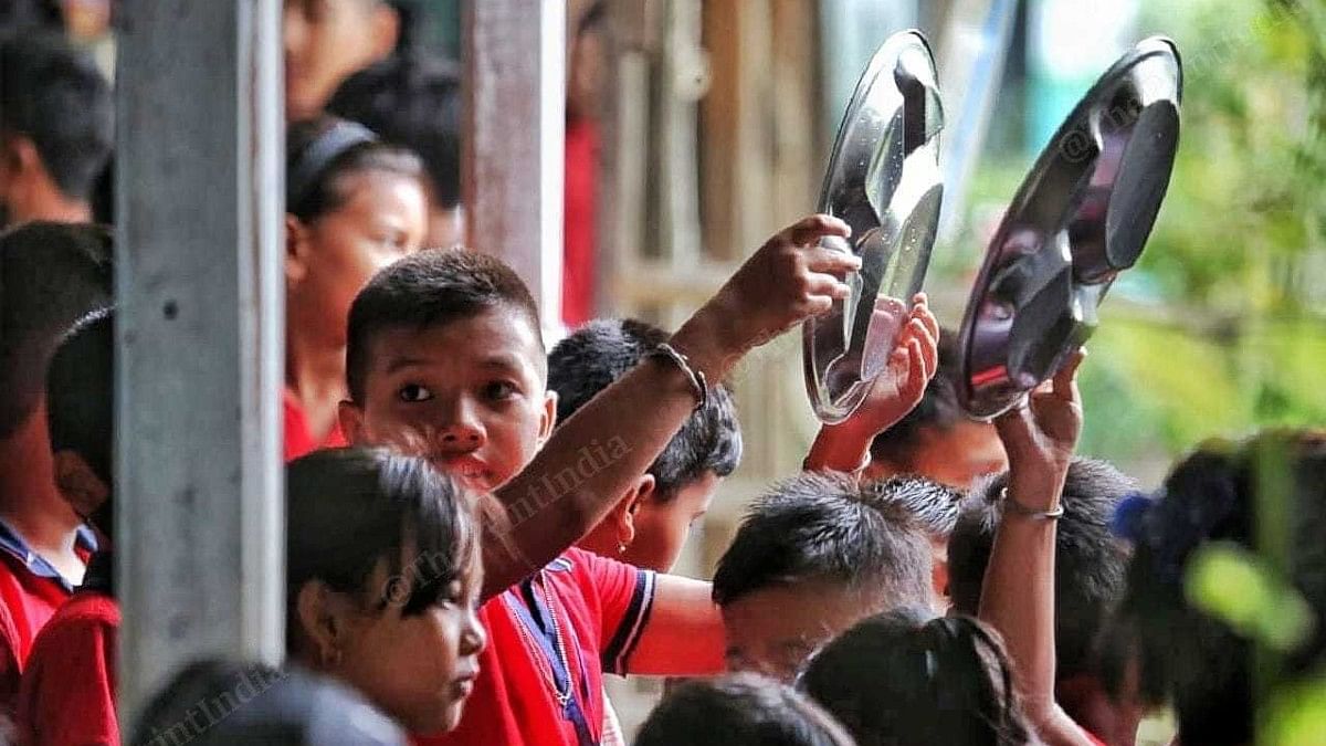 Children queue up outside the school kitchen | Praveen Jain | ThePrint