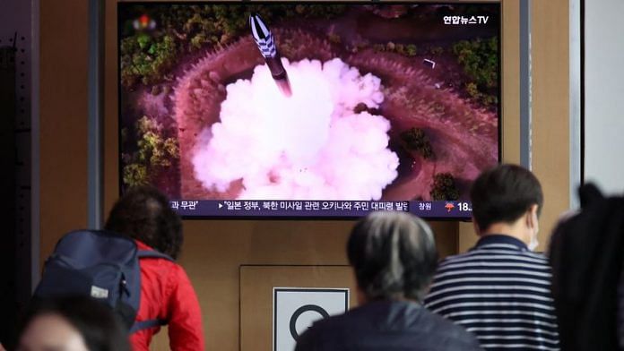 People watch a TV broadcasting a news report on North Korea firing what it called a space satellite toward the south, in Seoul, South Korea, May 31, 2023 | Reuters