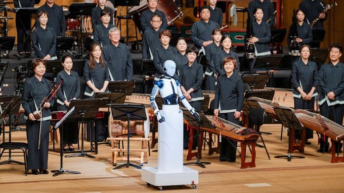An android robot, EveR 6, is seen as it takes the conductor's podium to lead a performance by South Korea's national orchestra, in Seoul, South Korea, June 30, 2023 | Reuters