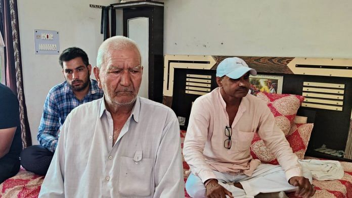 Raj Kumar Sangwan (in white), head of one of the families facing social boycott in Charkhi village | Photo by Mahira Khan, ThePrint