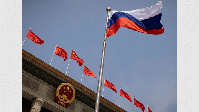 The Russian national flag flies in front of the Great Hall of the People before a welcoming ceremony for Russian Prime Minister Mikhail Mishustin in Beijing, China, May 24, 2023 | Reuters