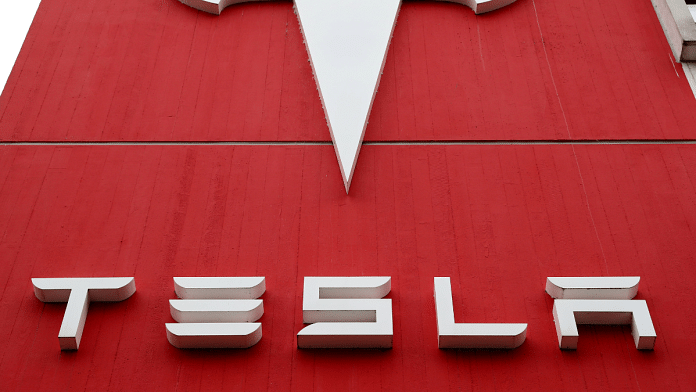 The logo of car manufacturer Tesla is seen at a branch office in Bern, Switzerland | Reuters