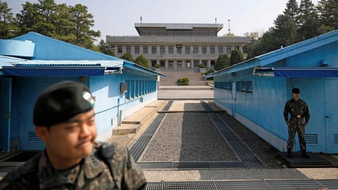 South Korean soldiers stand guard at the truce village of Panmunjom inside the demilitarized zone (DMZ) separating the two Koreas | Reuters
