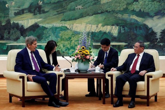 US Special Presidential Envoy for Climate John Kerry and Chinese Premier Li Qiang attend a meeting at the Great Hall of the People in Beijing, on 18 July 2023 | Reuters