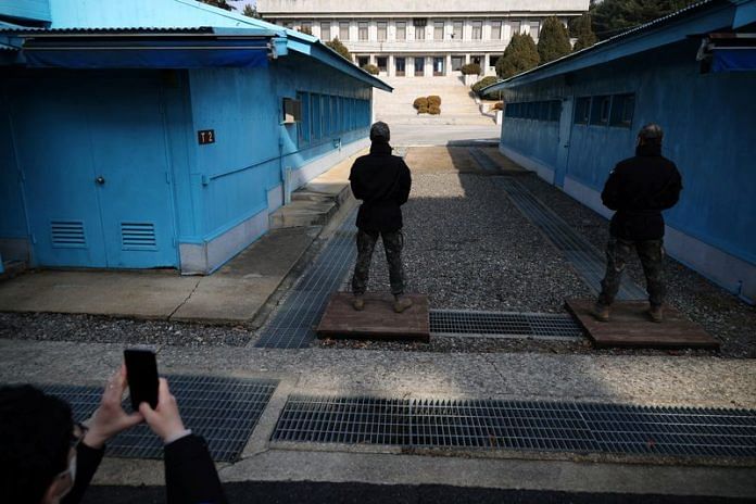 A media member takes a photograph of South Korean soldiers standing guard in the truce village of Panmunjom inside the demilitarized zone (DMZ) separating the two Koreas | Reuters file photo