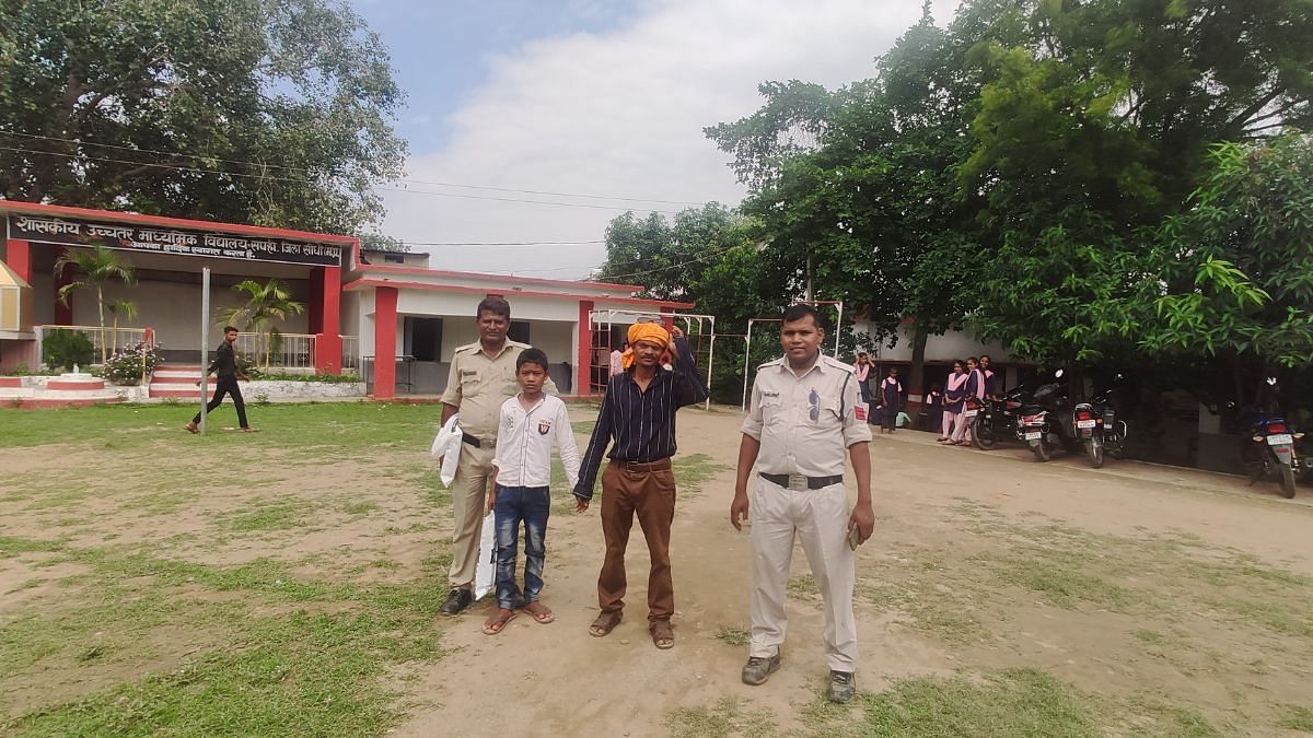 Accompanied by two constables, Dashmat walking out of Government Higher Secondary School, Sapahi after completing the admission formalities for his son Rahul | Iram Siddique, ThePrint