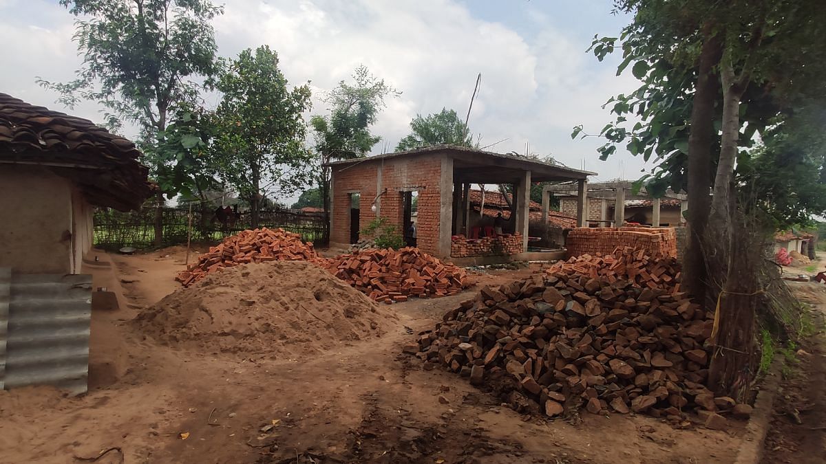 Bricks, stone and cement dumped around Dashmat's new house which is being constructed under PM Awas Yojna | Iram Siddique, ThePrint