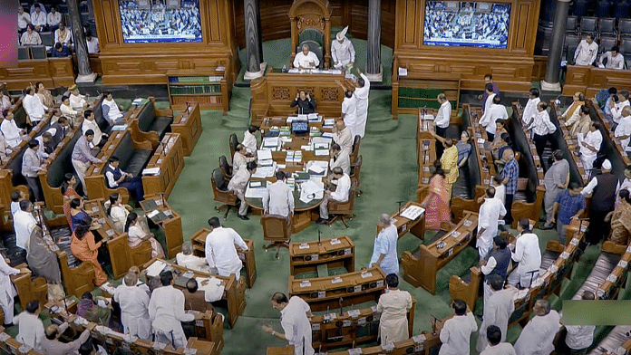 Opposition MPs stage a protest in the Lok Sabha during the Monsoon Session of Parliament in New Delhi |ANI Photo/SansadTV