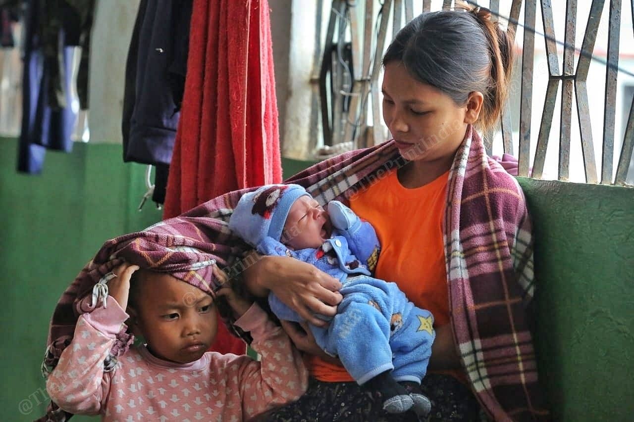 Lhingthiannei Vaithei mother newborn baby Thangminchung with his brother Photo: Praveen Jain | ThePrint