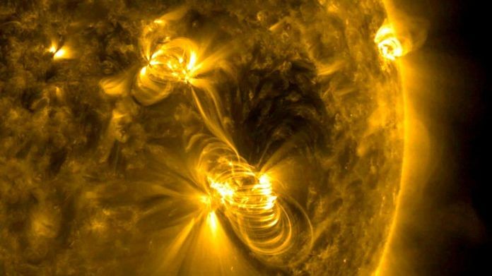 A medium-sized (M2) solar flare and a coronal mass ejection (CME) erupting from the same, large active region of the Sun | NASA/GSFC/Solar Dynamics Observatory/Handout via Reuters file photo