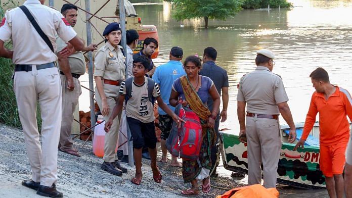 Amrutha Guguloth with Delhi Police and NDRF personnel carries out a rescue operation of the flood-affected people from Yamuna Khadar, Mayur Vihar, in New Delhi, on 12 July 2023 | ANI photo