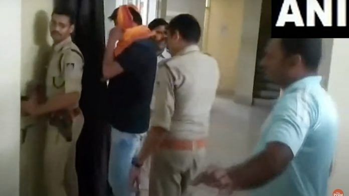 Screengrab of the video after the accused was arrested by the MP Police | ANI Video