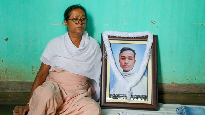 Thaba Leima with her son's photo | Photo: Suraj Singh Bisht | ThePrint