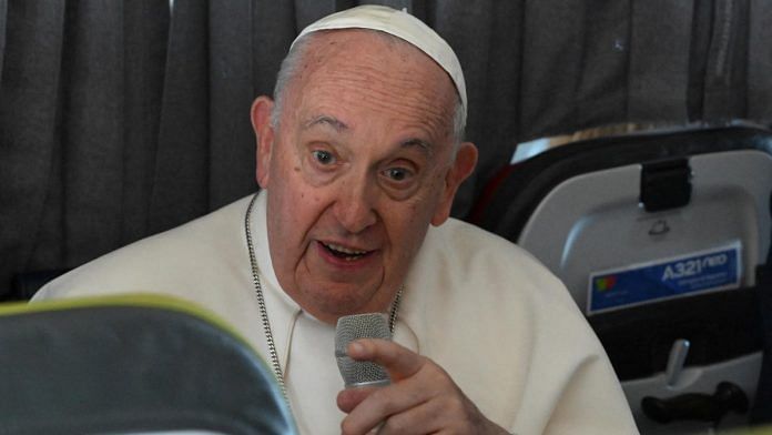 Pope Francis attends a press conference onboard a plane en route to Rome | ANSA/Maurizio Brambatti/Pool via Reuters