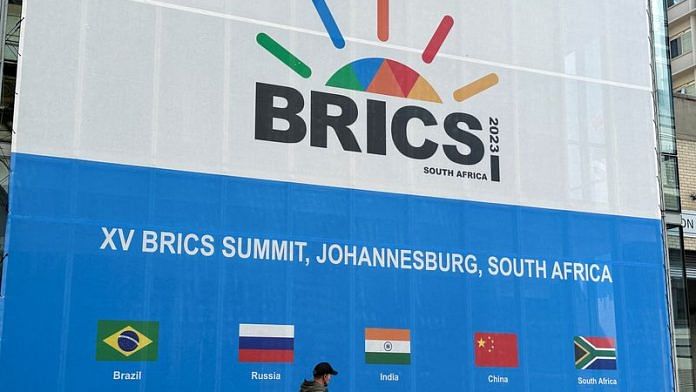 A person walks past the Sandton Convention Centre, which will host the upcoming BRICS Summit, in Johannesburg, South Africa August 19, 2023 | Reuters