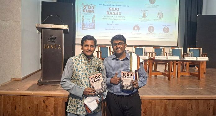 Authors Tuhin A. Sinha and Suraj (Clark) Prasad with their book Sio-Kanhu | Karizma Ahmed | ThePrint