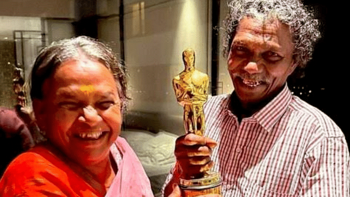 Bomman and Bellie with the Oscar trophy | Twitter: @EarthSpectrum
