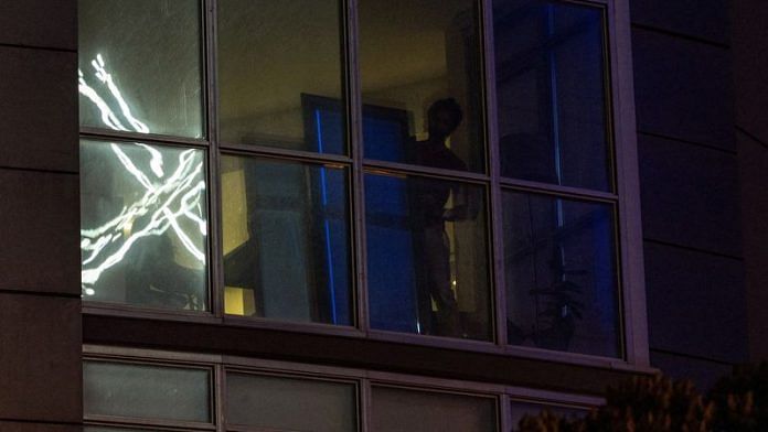 'X' logo is seen reflected on an apartment window across the street from the headquarters of the messaging platform in downtown San Francisco, California | Reuters