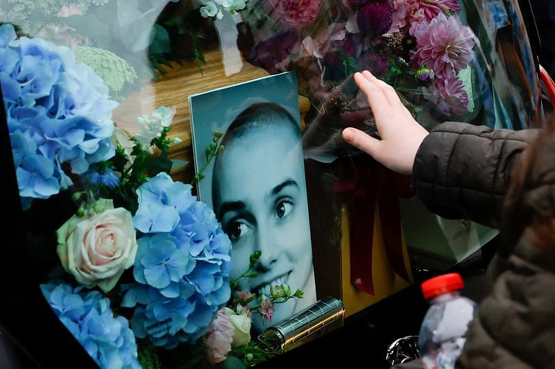 Fans bid seaside farewell to Sinead O'Connor with songs, flags and