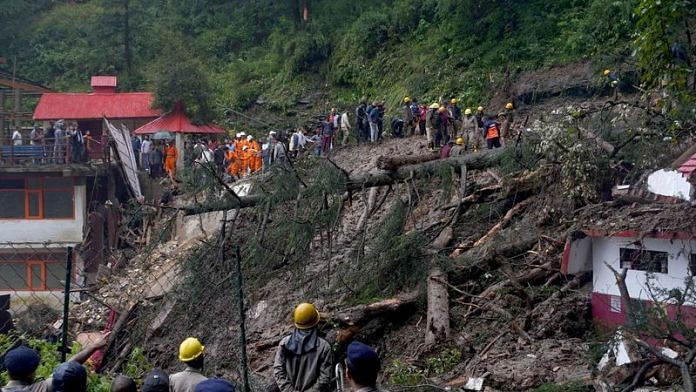 Rescue workers remove the debris as they search for survivors after a landslide following torrential rain in Shimla in the northern state of Himachal Pradesh, India, August 14, 2023 | Reuters