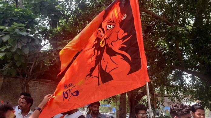 Protesters brandishing flag during demonstration in Subhash Nagar, Wednesday | Bismee Taskin | ThePrint