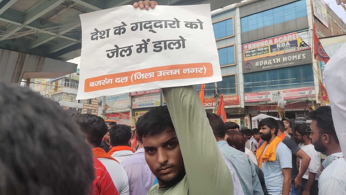 Protester holding up placard in Dwarka, Wednesday | Bismee Taskin | ThePrint