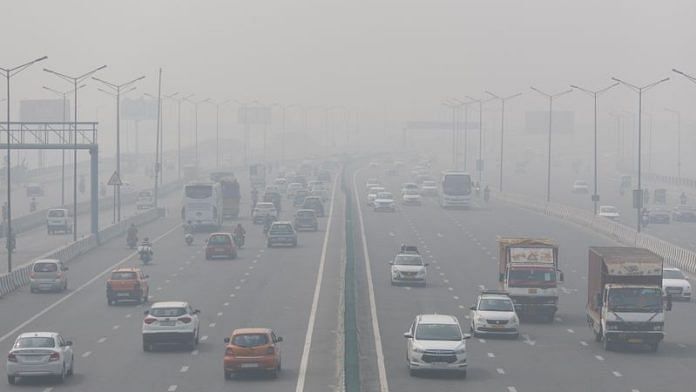 Traffic moves along a highway shrouded in New Delhi, India, November 3, 2022 | Reuters