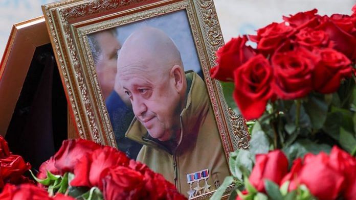 A view shows a framed photo of Russian mercenary chief Yevgeny Prigozhin at his grave at the Porokhovskoye cemetery in Saint Petersburg, Russia | Reuters
