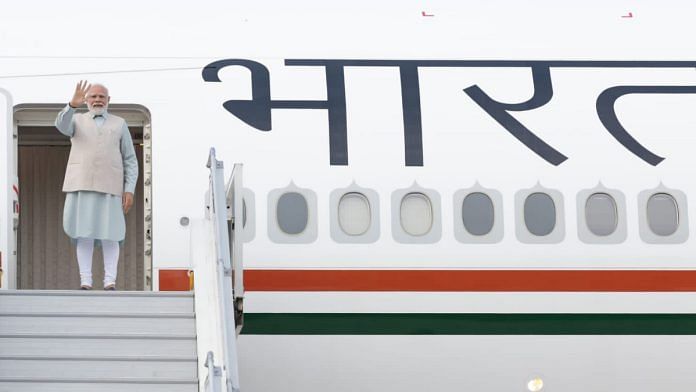 PM Narendra Modi waves while leaving for his visit to South Africa and Greece, in New Delhi, on 22 August 2023 | PTI