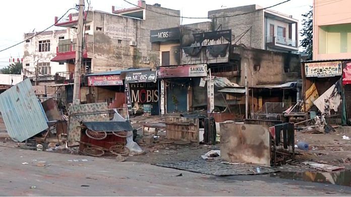 Shops and properties damaged after a clash broke out in Haryana's Nuh | Photo: ANI