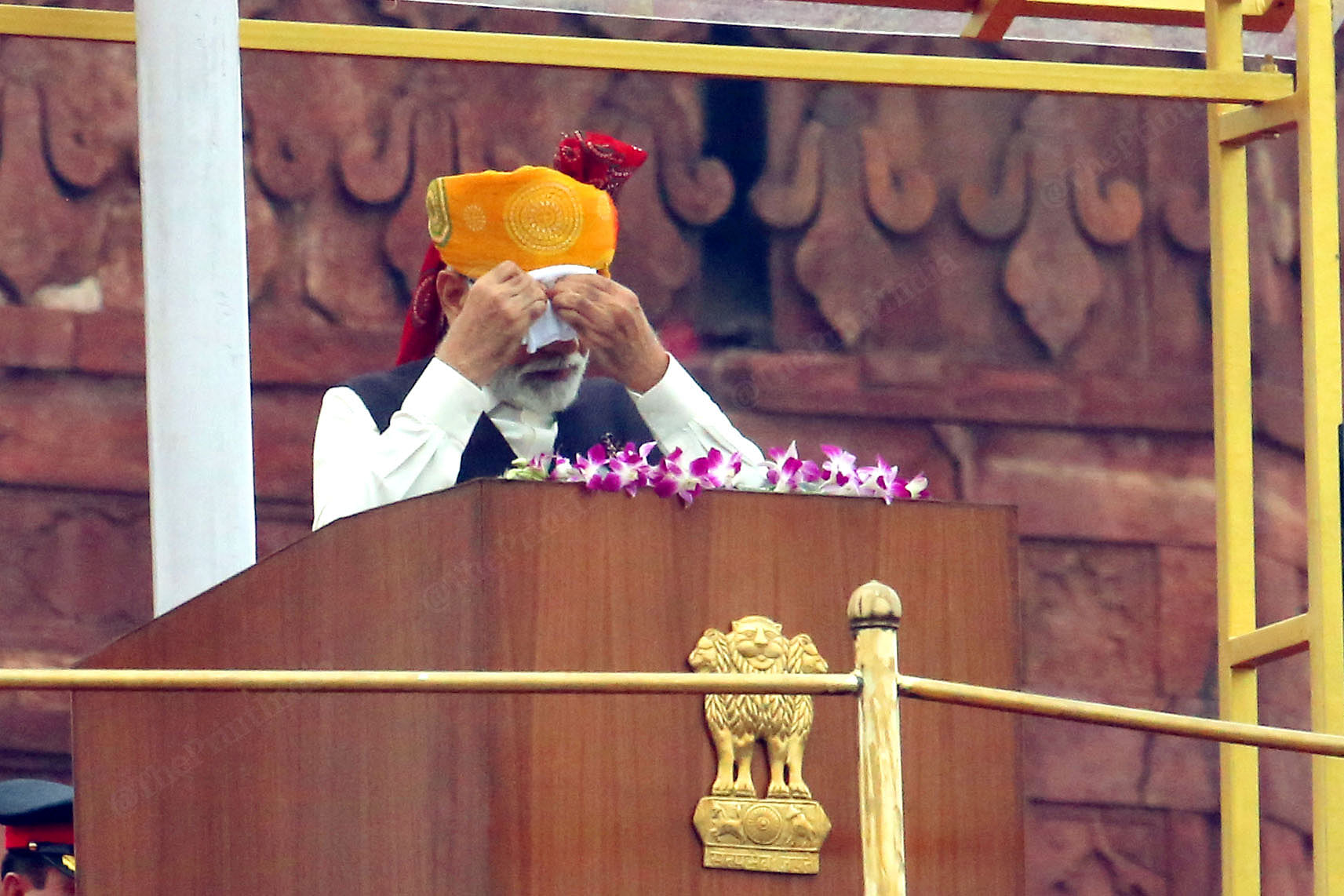 While addressing the gathering, PM Modi took out his handkerchief to wipe the sweat away. PM Modi delivered a 90 minutes long after unfurling the flag | Photo: Praveen Jain | ThePrint