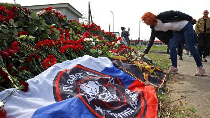 A woman visits a makeshift memorial near former PMC Wagner Centre, associated with the founder of the Wagner Group, Yevgeny Prigozhin, in Saint Petersburg, Russia August 24, 2023 | Reuters