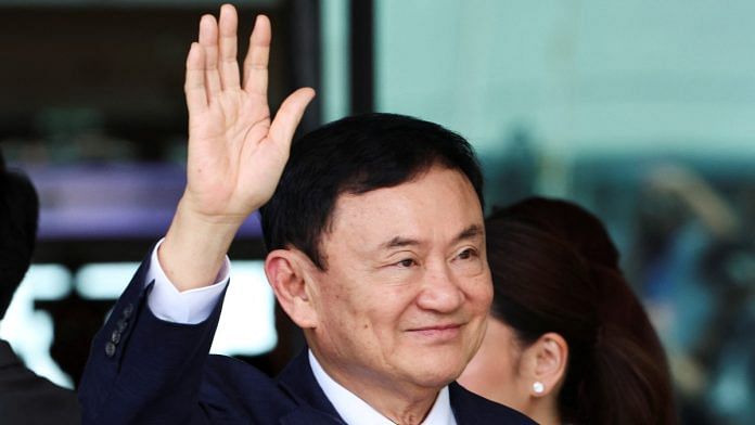 Former Thai Prime Minister Thaksin Shinawatra waves at Don Mueang airport in Bangkok, on 22 August 2023 | Reuters